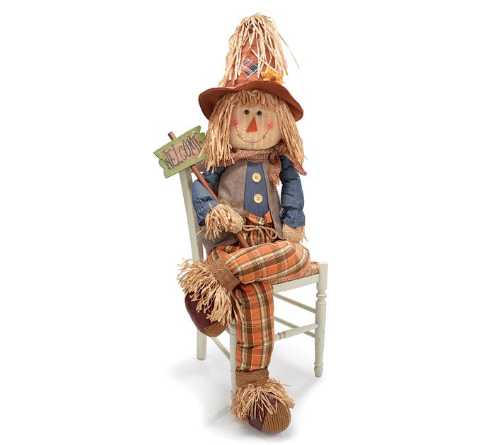 Sitting Scarecrow With Welcome Sign